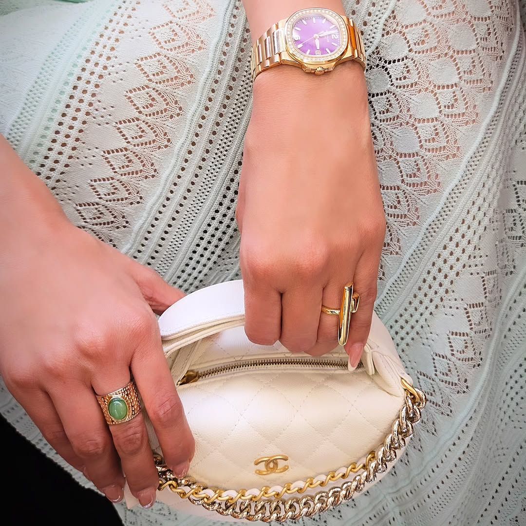 May be an image of 1 person, ring and wrist watch